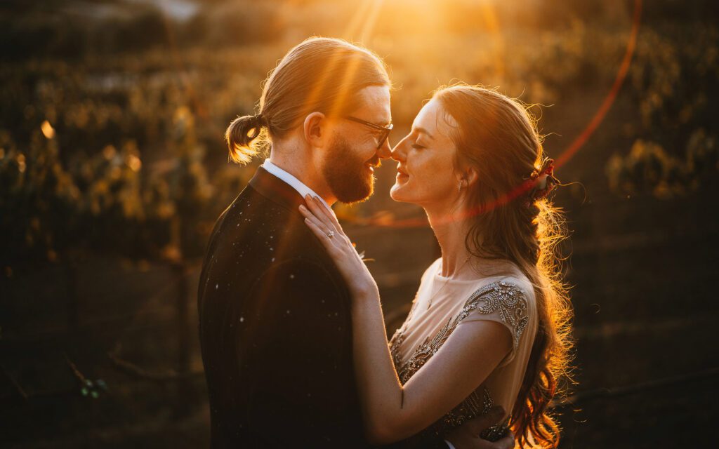 A romantic sunset portrait of a couple at leal vineyards to showcase an example of a couple that prioritized light. 