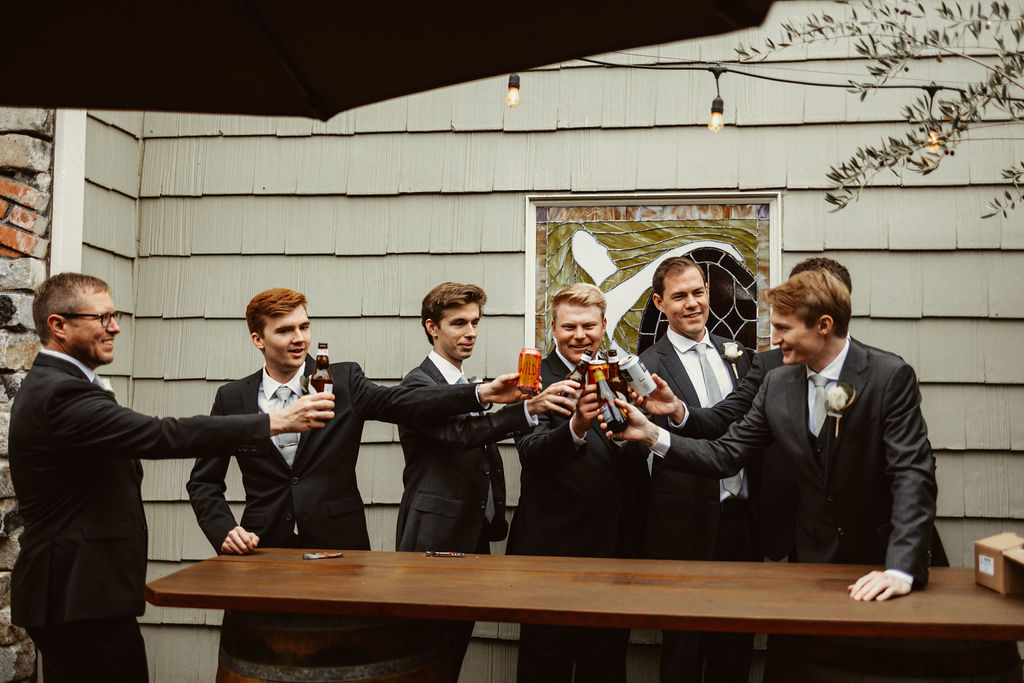groom and groomsmen cheersing outside the grooms room at Mountain house estate in cloverdale califonria