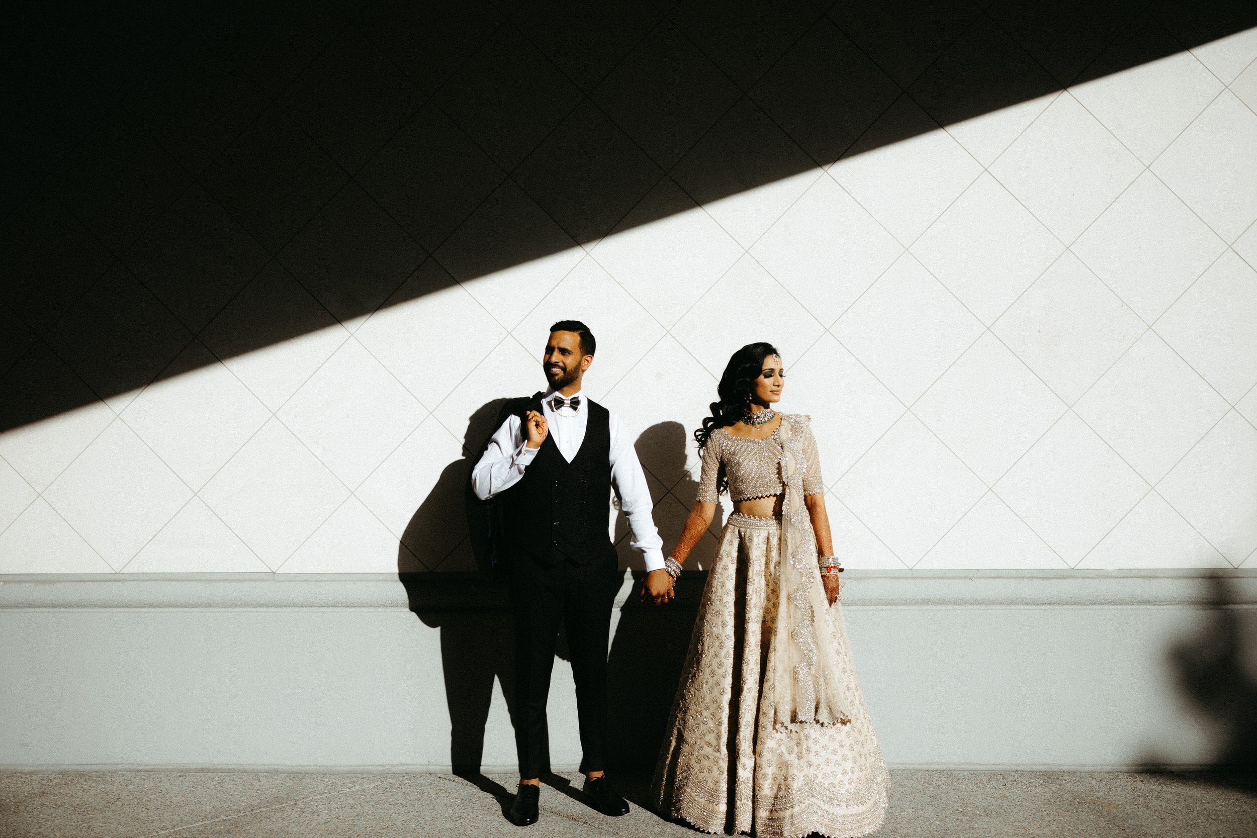 Romantic couple portrait under sunlit trees at Bay Area wedding venue