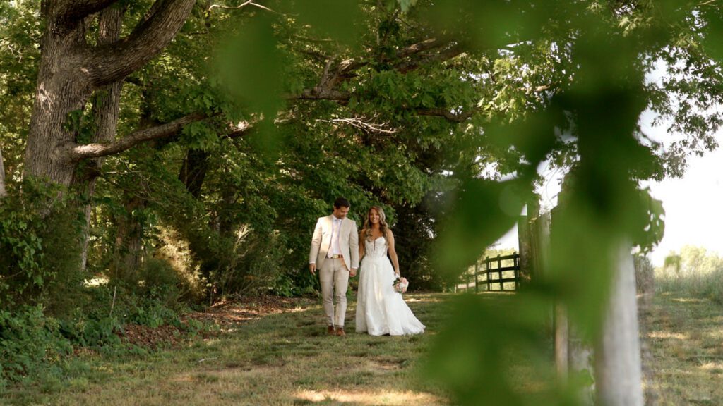 Bride and groom smiling and walking together at Carolina Country Weddings in Mount Pleasant North Carolina